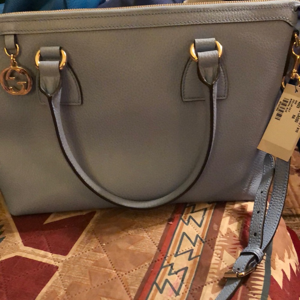 Gucci convertible with strap